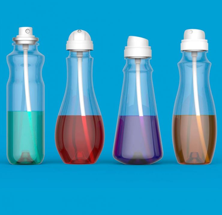 Plastic aerosol bottles on blue background