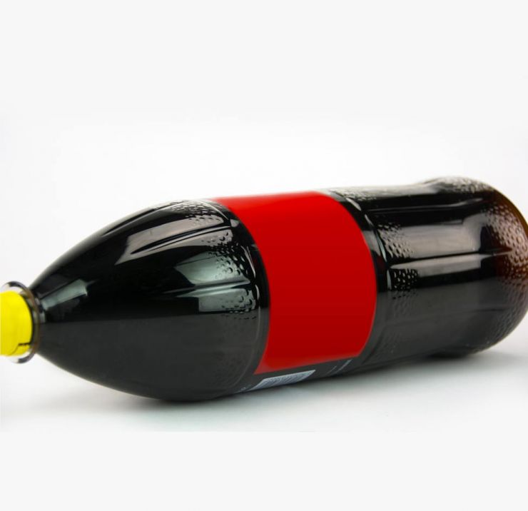 Plastic Coke bottle lying on its side